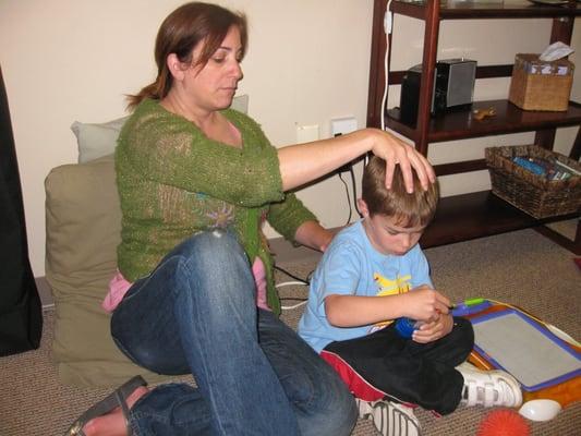 CranialSacral Therapy on my son while he played