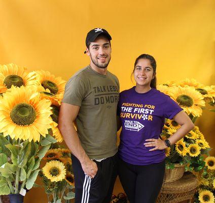 Couple's picture with our sunflower wall