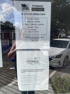 Signage from a second property of Storage Rentals of America stating they would be open Saturday but no one is at there locations.