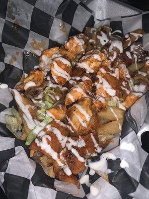 Wild West Fries! Thick cut golden French fries , light lettuce , bacon bits , and chopped grilled / fried Buffalo chicken! $7