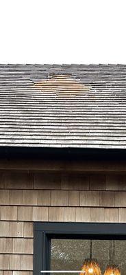 The new shingles were placed on the roof by Eagle Roofing Contractor, Inc. Note how it seems the shingles are the wrong size and buckling.