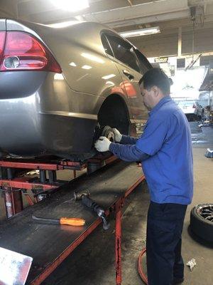 Fernando, doing his job. Checking my brakes.