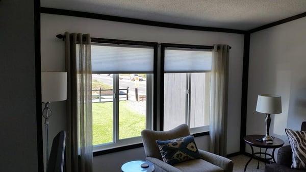 Grommetted Panels over cellular shades by Rendezvous shutters shades drapery in Santa Maria