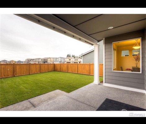 Outdoor living space & a low maint beautiful landscaped yard at one of the many new construction homes in Puyallup! Oakpointe.