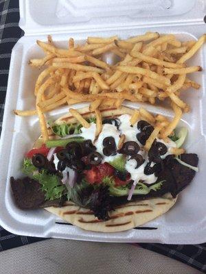 Lamb Gyro... with Tzatziki sauce,black olives, lettuce, tomatoes, onion,and green pepper.