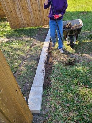 Cement  blocks on the outside of the driveway Gate