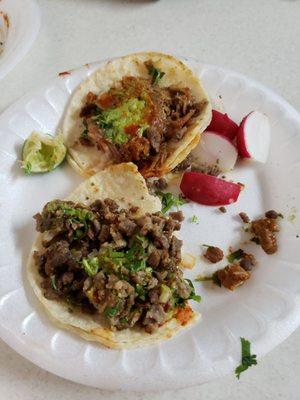 Two street tacos one mixed meat one asada