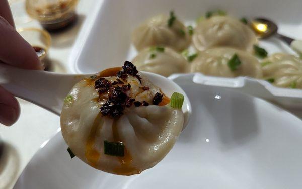 Soup dumplings / xiaolongbao with house made sauce and chili oil