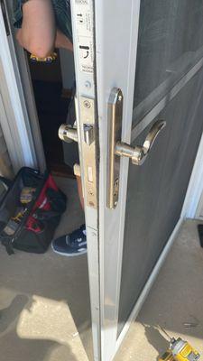 Repair storm door lock