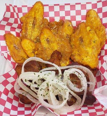 Carne Frita with tostones on garlic sauce.