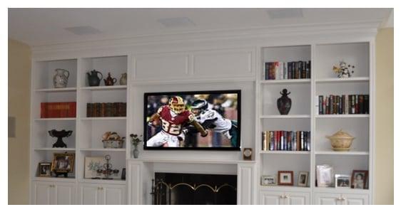 This is a typical media room setup, with a wall mount tv and in-ceiling speakers.