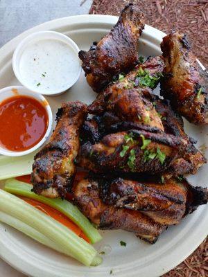 Chicken Wings: grilled crispy, and finished in the oven. Served dry our signature seasoning &  side of kicked-up buffalo and homemade ranch