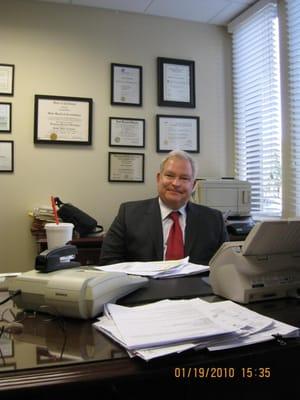 Greg in his office.