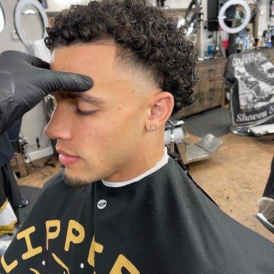 Mid high taper undercut with curls