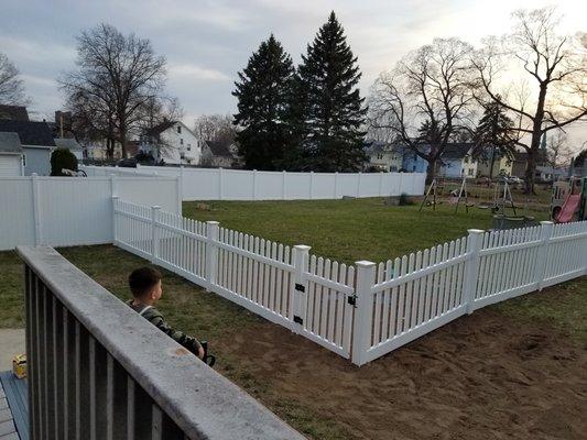 A&J Landscape Services final picture of vinyl fence installation.