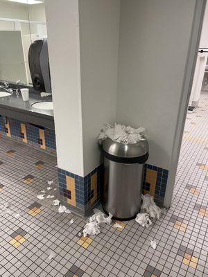 More overflowing trash cans. On a Tuesday morning. Garbage on the counters.