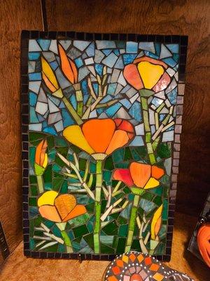 We display and sell mosaic art - made and designed  by Pam of PSST. Pam also made our business sign.