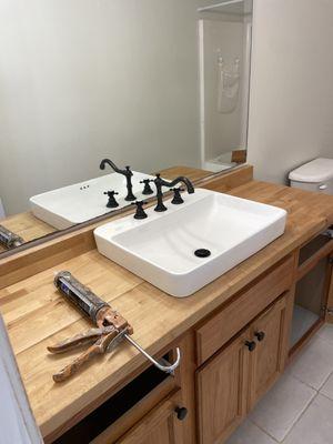 A counter made of butcher block we cut in and installed this sink