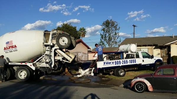 Pouring concrete into concrete pump truck