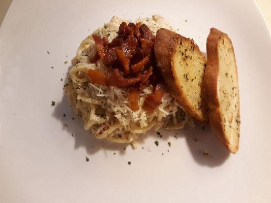 Chicken carbonara, with crisp bacon and parmesan garlic crostini.