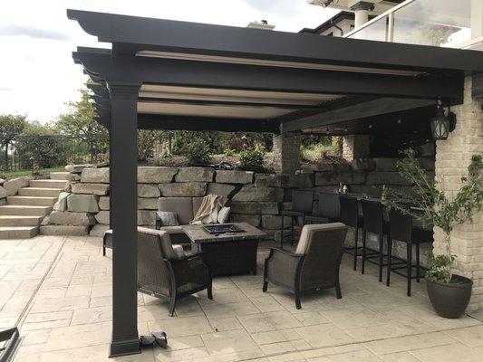 Motorized/remote controlled pergola added to lovely patio, to enhance and enlarge the outdoor living area.