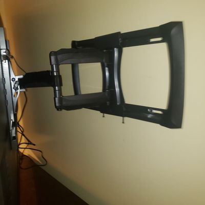 A wall mount that holds a 55" up to 80"