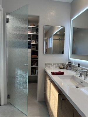 Rain glass frameless closet door, swings both directions