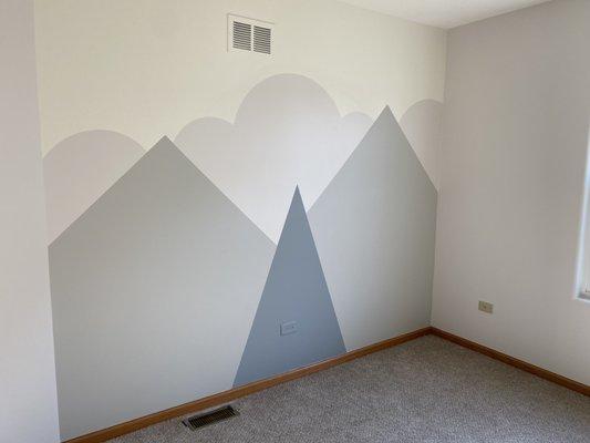 Playroom with decorative painted accent wall