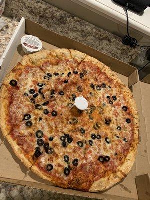 Large pizza with tomato and black olives