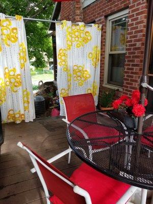 Creating an outdoor space, softened by flowing curtains.