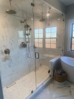 Steam shower 3/8 glass with swinging transom.  Seals very tight and is pure perfection.  Aged brass hardware