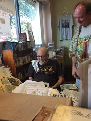 Bob looks over some records with a customer