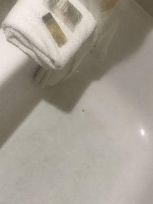 Dirty tub with used towels folded