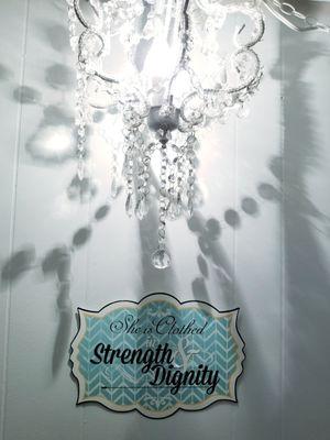 SHE'S CLOTHED WITH STRENGTH & DIGNITY at French Kiss Boutique in Thomaston, Georgia.