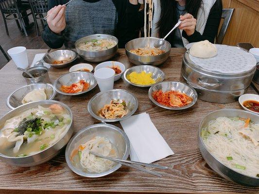 Anchovy noodles bottom right, seafood dough soup bottom left, mandu noodles top left, eggplant sauce noodles top right