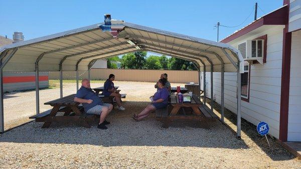 Covered seating outside even special picnic tables for little ones.