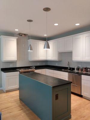 A sleek kitchen w freshly painted cabinets!  www.nickslavik.com