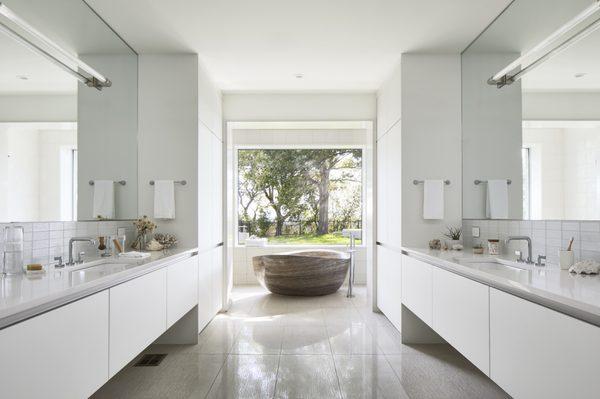 Modern bath with freestanding sculpted stone tub