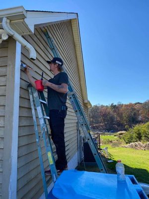 This client wants to preserve there siding for a few more years so we gave this lake house a brand new look!