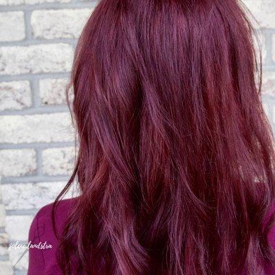 We decided to take advantage of her base and used it to create depth within her color. This brilliant red is the result!