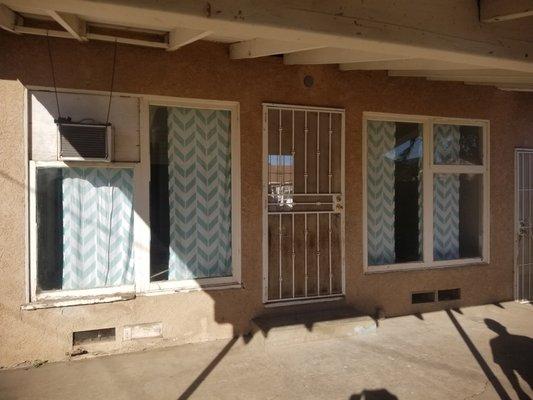 Before: Old rotted wooden windows with single pane glass.