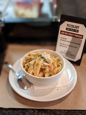 N'duja Alfredo Penne (grilled chicken, roasted artichokes, spinach, fresno chilies, n'duja-spiced alfredo sauce)