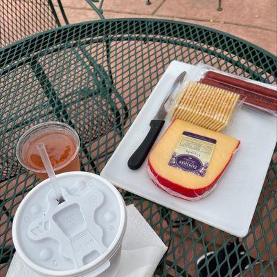 Roadhouse Red Slushy A glass of Sunset Blush wine Gouda cheese Beef sticks and crackers!