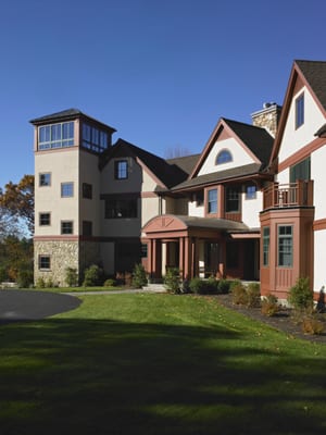 Inspired by the pastoral setting and sweeping views of the Wachusett Valley, this custom home was designed as three smaller i...