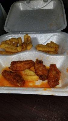 This is a photo of the small soggy wings and fries they are now serving!