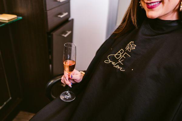 Enjoy a complementary glass of wine, mimosa, or coffee while getting pampered at BE Salon