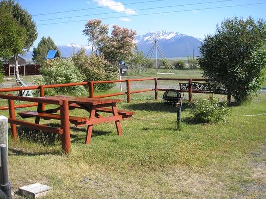 RV site with firepit, picnic table, yard, full hookups