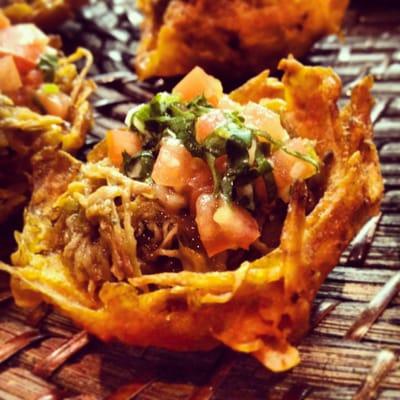 Pabellon: plantain basket stuffed with shredded beef, black beans pure & pico de gallo