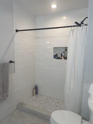 Bathroom remodel after (new shower, new tiles)