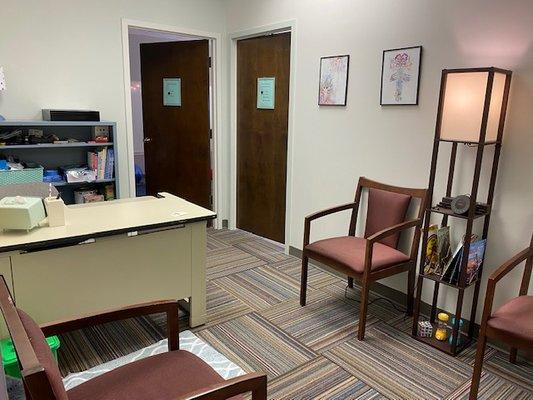 Waiting room area with sensory friendly lighting and ambient sounds.